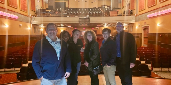 Fort DuPont team on stage in the Everett theater